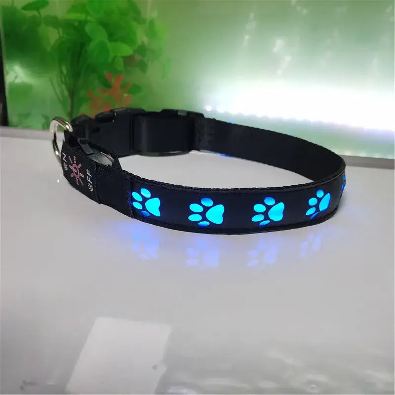 luminous dog collar with blue glowing paw prints, adjustable black nylon LED pet collar for safe night walking