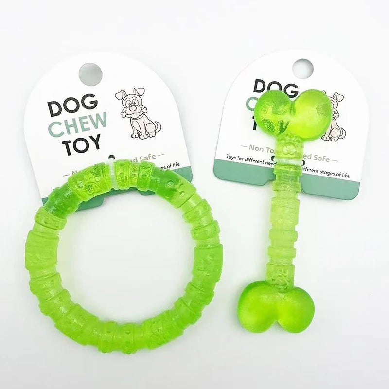 Green non-toxic dog chew toys in bone and ring shapes on white background