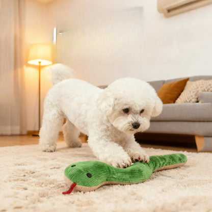White puppy playing with plush snake pet chew toy on a rug in a cozy living room, bite-resistant and teeth-cleaning