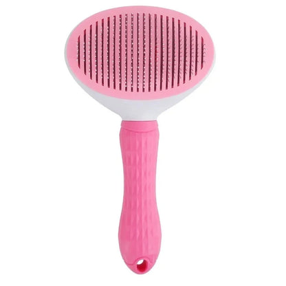 Pink dog grooming brush with textured handle and fine metal bristles on white background