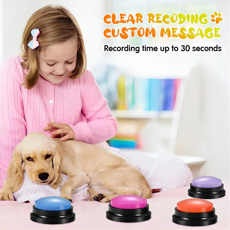 Girl with dog and colorful recordable communication buttons for pets on bed