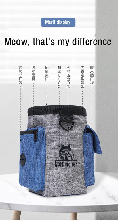 Gray and blue waterproof dog treat pouch with pockets, zipper, and D-ring on a table