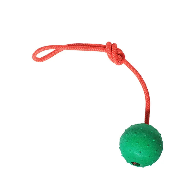 Green textured dog ball toy with red rope, durable fetch and chew toy for pets