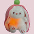 Glowing stuffed animal sleep aid white plush bunny in pink hood with green top, calming bedtime toy for kids