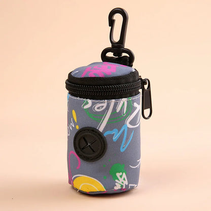 Colorful dog poop bag holder with zipper and clip, abstract print on gray background