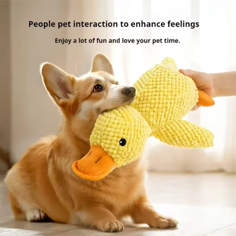 bite resistant dog plush toy corgi playing with yellow duck chew toy for interactive teeth cleaning