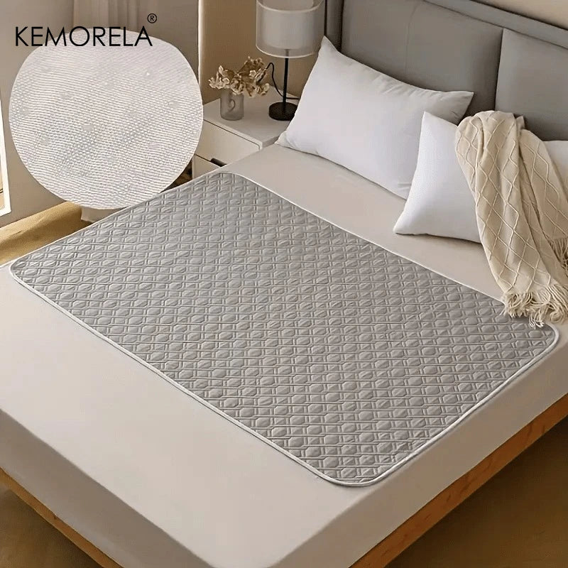 Grey waterproof dog bed cover pad on a modern bed, quilted pattern, close-up texture inset.