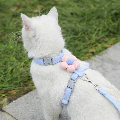 Blue adjustable small dog harness leash set on white cat, breathable pet strap for walking, cute flower detail