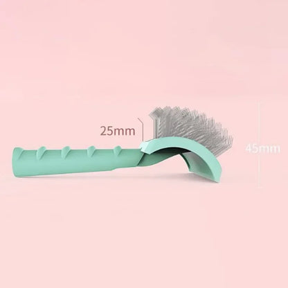 Mint green dog grooming brush with curved handle and fine metal bristles on pink background