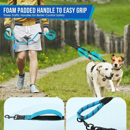 Man walking two dogs with a blue dual dog leash featuring foam padded handles on a path