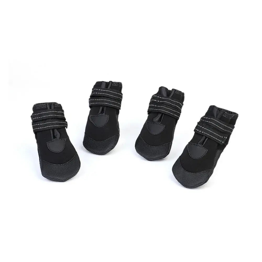Adjustable waterproof dog boots set in black with anti-slip design and reflective straps for outdoor use.
