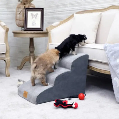 Two small dogs using anti-slip dog stairs for small dogs to reach a couch, showcasing a cozy living room setting.