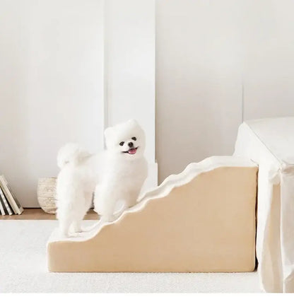 A small dog standing on anti-slip dog stairs for small dogs, designed to protect joints and provide easy access.