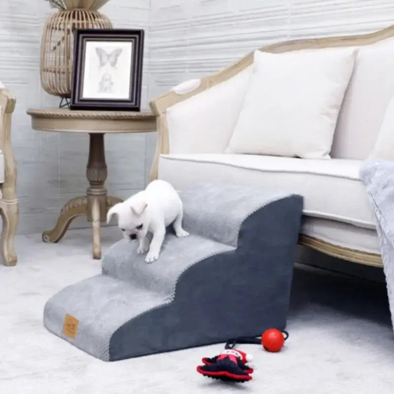 Anti-slip dog stairs for small dogs beside a couch, designed for easy access and joint protection.