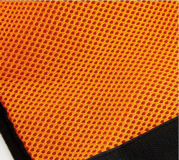 Close-up of the breathable polyester fabric used in the dog walking assist harness, featuring a vibrant orange mesh design.
