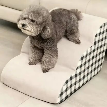 Cute dog using dog stairs for senior pets to easily reach a raised surface, featuring a soft safety ramp design.