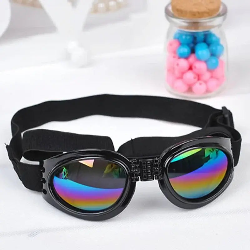 Black dog sunglasses with foldable round lenses, adjustable strap, and windproof sun protection for pets