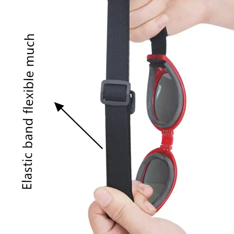 Adjustable dog sunglasses with flexible elastic band and chin strap for secure fit, red foldable pet goggles