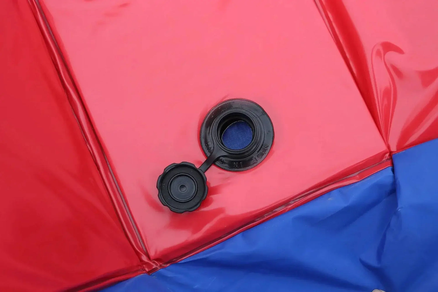 Close-up of drain valve on a foldable pet pool, ideal for the portable dog bathing tub.