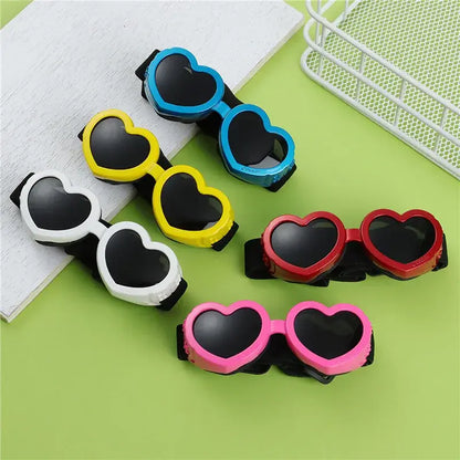 Heart-shaped dog sunglasses with adjustable strap for small pets, colorful UV protection goggles for cats and dogs