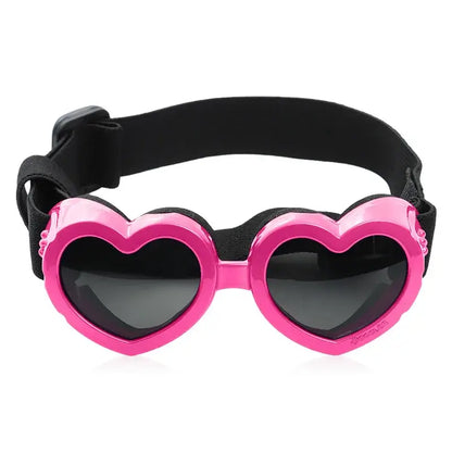 Pink heart-shaped dog sunglasses with adjustable strap for small pets, UV protection, lightweight pet eyewear