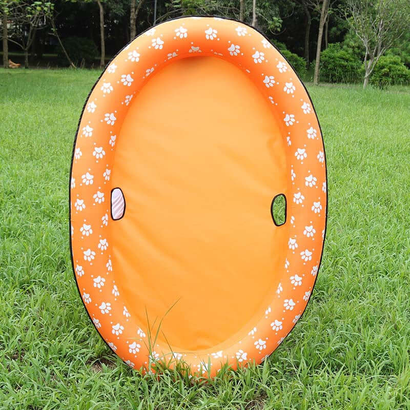 Inflatable dog swimming pool float in vibrant orange color with paw print design, perfect for pets to relax and enjoy summer.