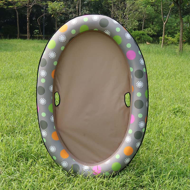 inflatable dog swimming pool float with brown polka dots design, ideal for pets to relax in water, set on grass.