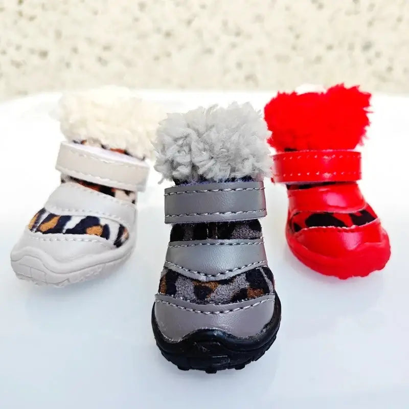Three pairs of colorful leopard boots for small dogs, ideal winter leopard boots for small dogs, featuring fluffy tops and Velcro straps.
