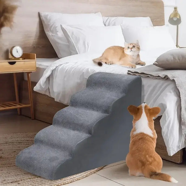 memory foam dog stairs for small pets placed beside a bed with a dog and a cat.