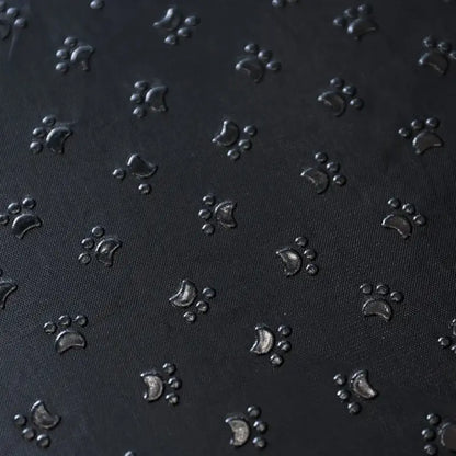 Textured black surface with embossed paw prints for memory foam dog stairs for small pets.