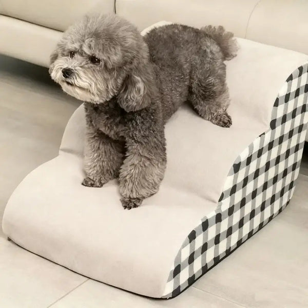 Non-slip foam dog stairs for small dogs with a fluffy dog standing on the steps, providing support for older pets.