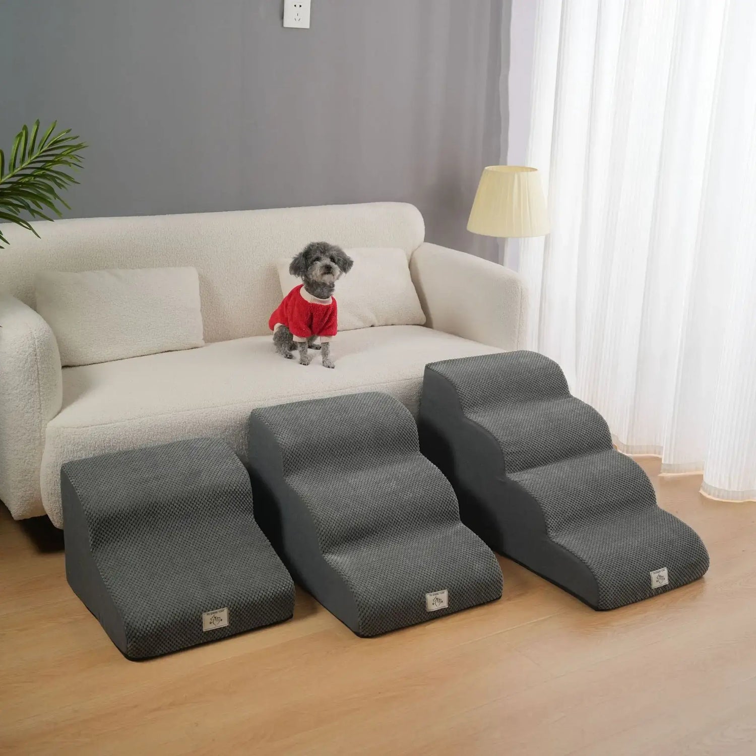 Washable non slip dog stairs for small dogs beside a sofa, designed for elderly pets to climb easily.