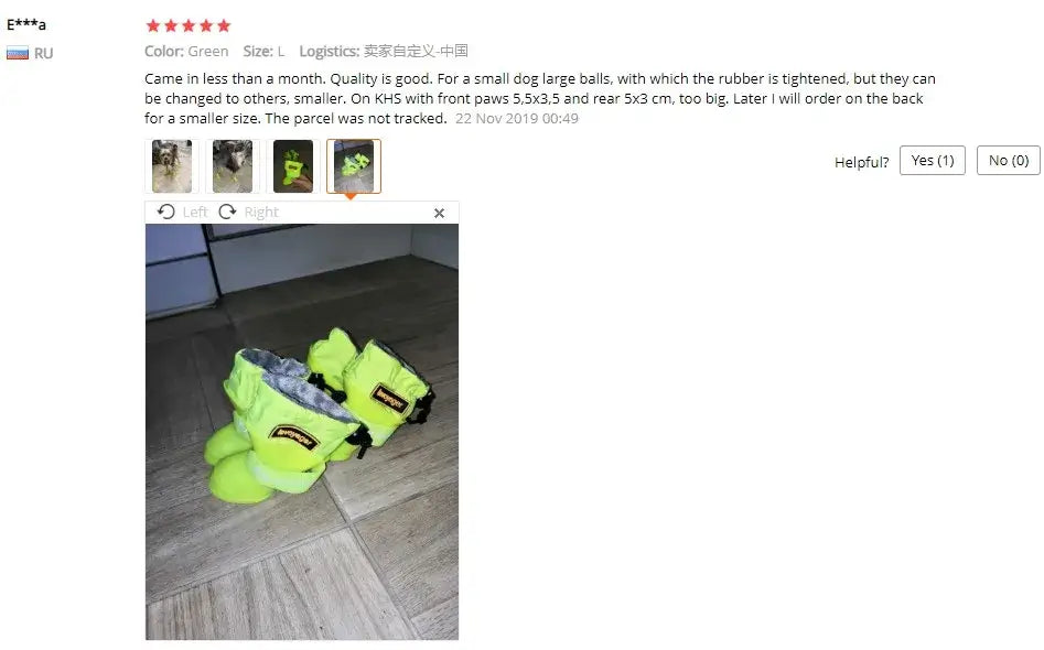 Waterproof dog rain boots in green color for small dogs, displayed on a floor.