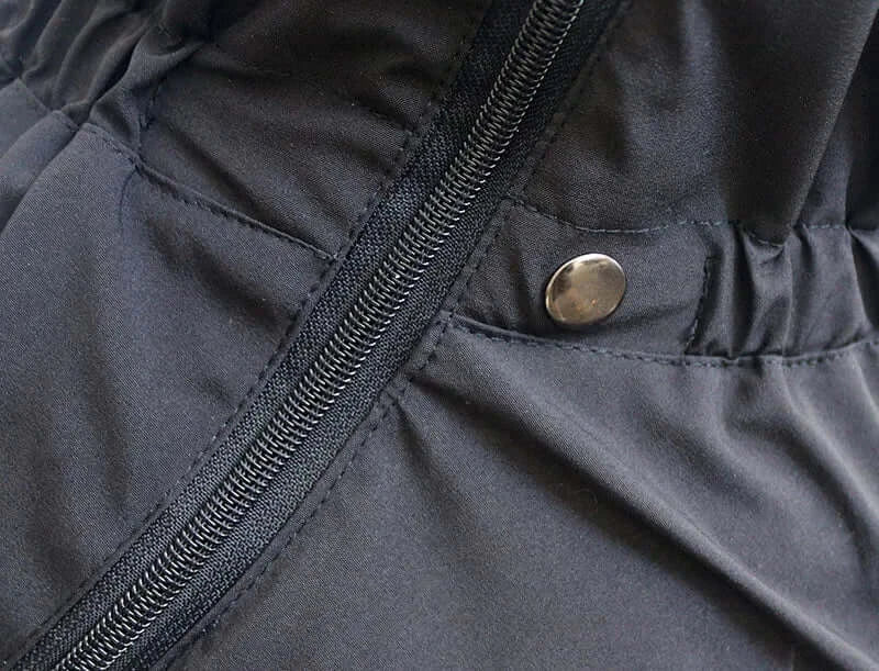 Waterproof dog winter coat with reflective black insulated fabric, zipper closure, and snap button for outdoor dogs