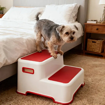 Portable dog stairs for small breeds with a small dog using a two-step ramp near a bed.