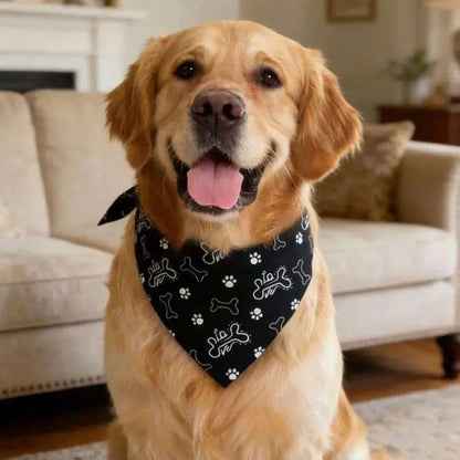 Golden retriever wearing reversible dog bandana with bone and paw print pattern, stylish pet accessory for small dogs