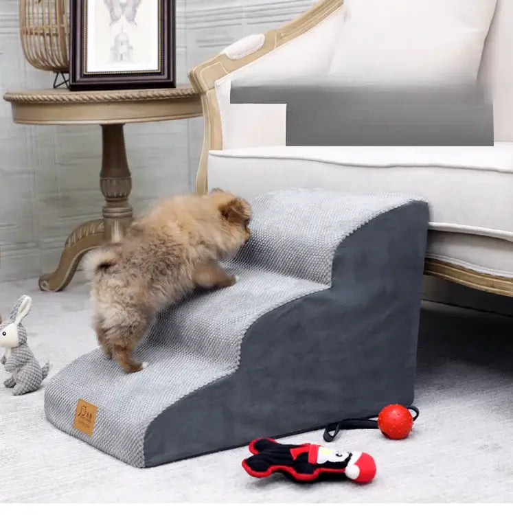 A small dog using anti-slip dog stairs for small dogs to climb onto a couch in a cozy living room setting with toys nearby.