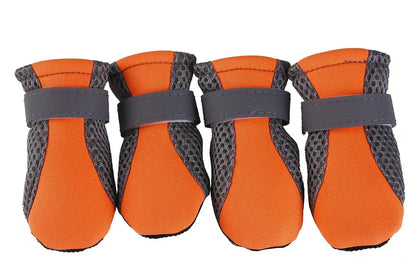 Orange waterproof dog boots with anti-slip rubber soles and adjustable straps for small to large pets