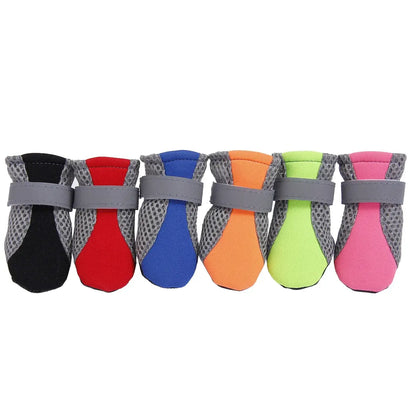 Colorful waterproof dog boots with anti-slip rubber soles and adjustable straps for puppies and small dogs