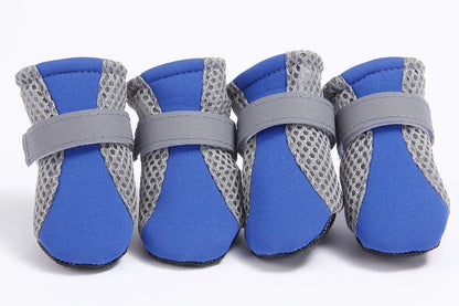 Waterproof dog boots in blue with anti-slip soft soles, breathable mesh, and adjustable straps for outdoor pet protection