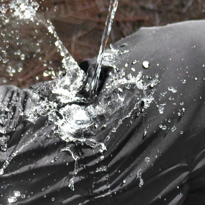 waterproof dog winter coat for dogs with reflective warm outdoor jacket, shown resisting water splashes