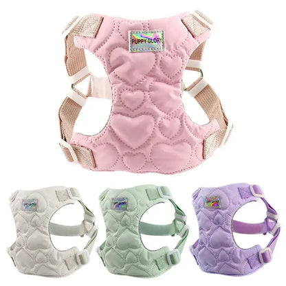 Pink waterproof puppy harness with heart pattern and adjustable straps for small, medium, and large dogs